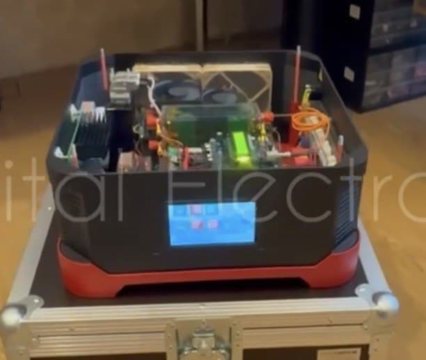 VENDOR.Max prototype unit during endurance test preparation — open configuration showing internal electrodynamic architecture before sealed black-box testing