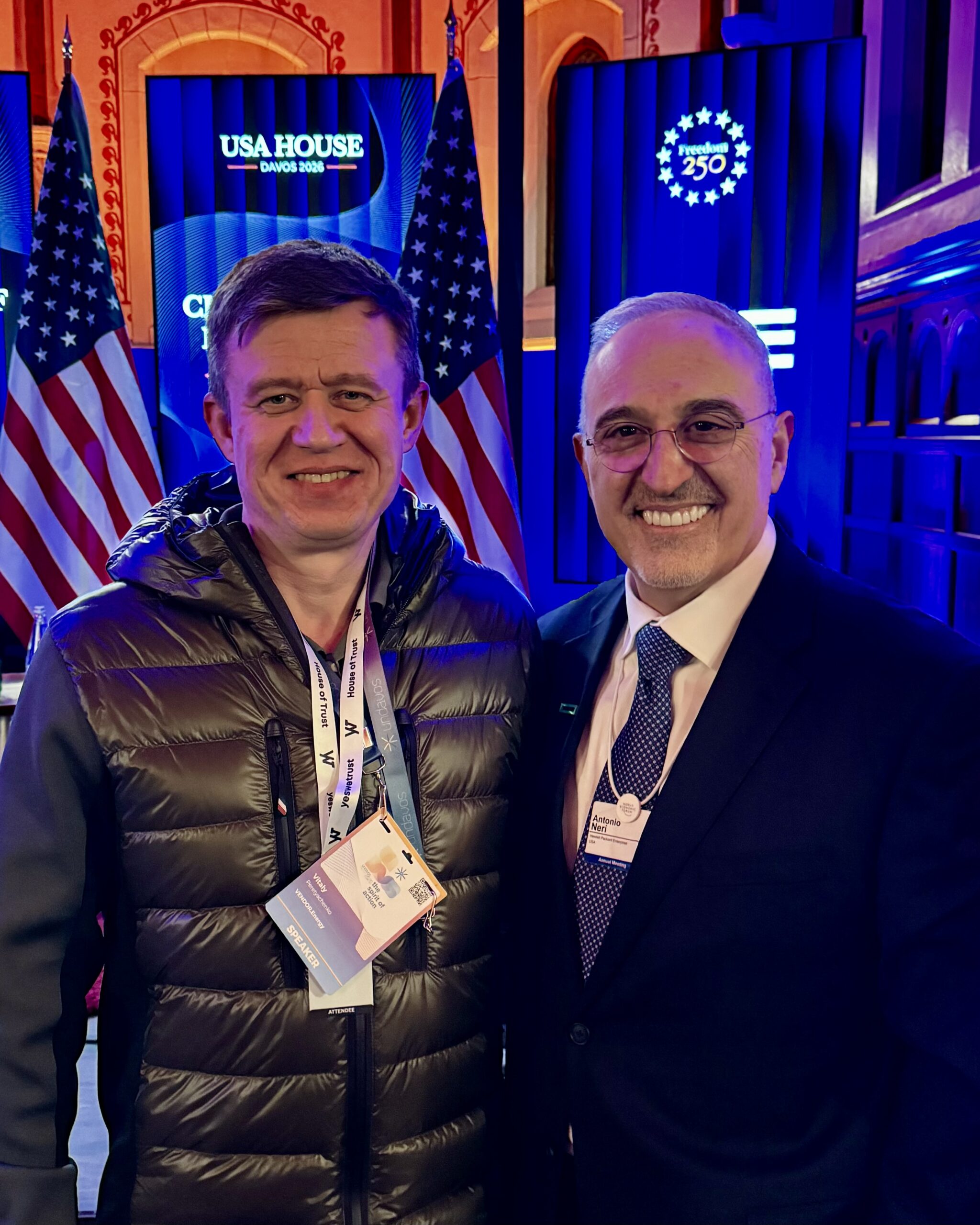 Vitaly Peretyachenko with Antonio Neri at the USA House during the Hewlett Packard Enterprise Champions of Innovation event at Davos 2026, discussing energy and infrastructure topics